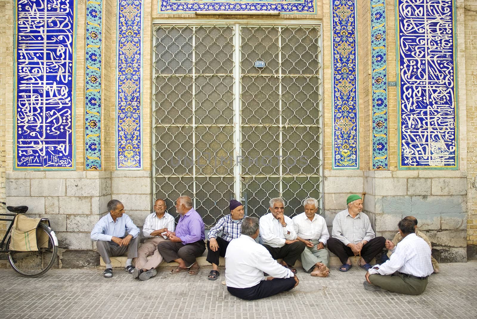 old men socializing outside mosque in yazd iran