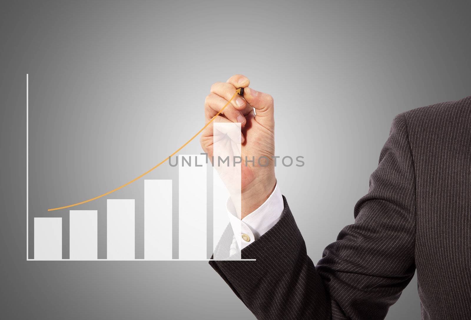 Male hand drawing a graph, grey background