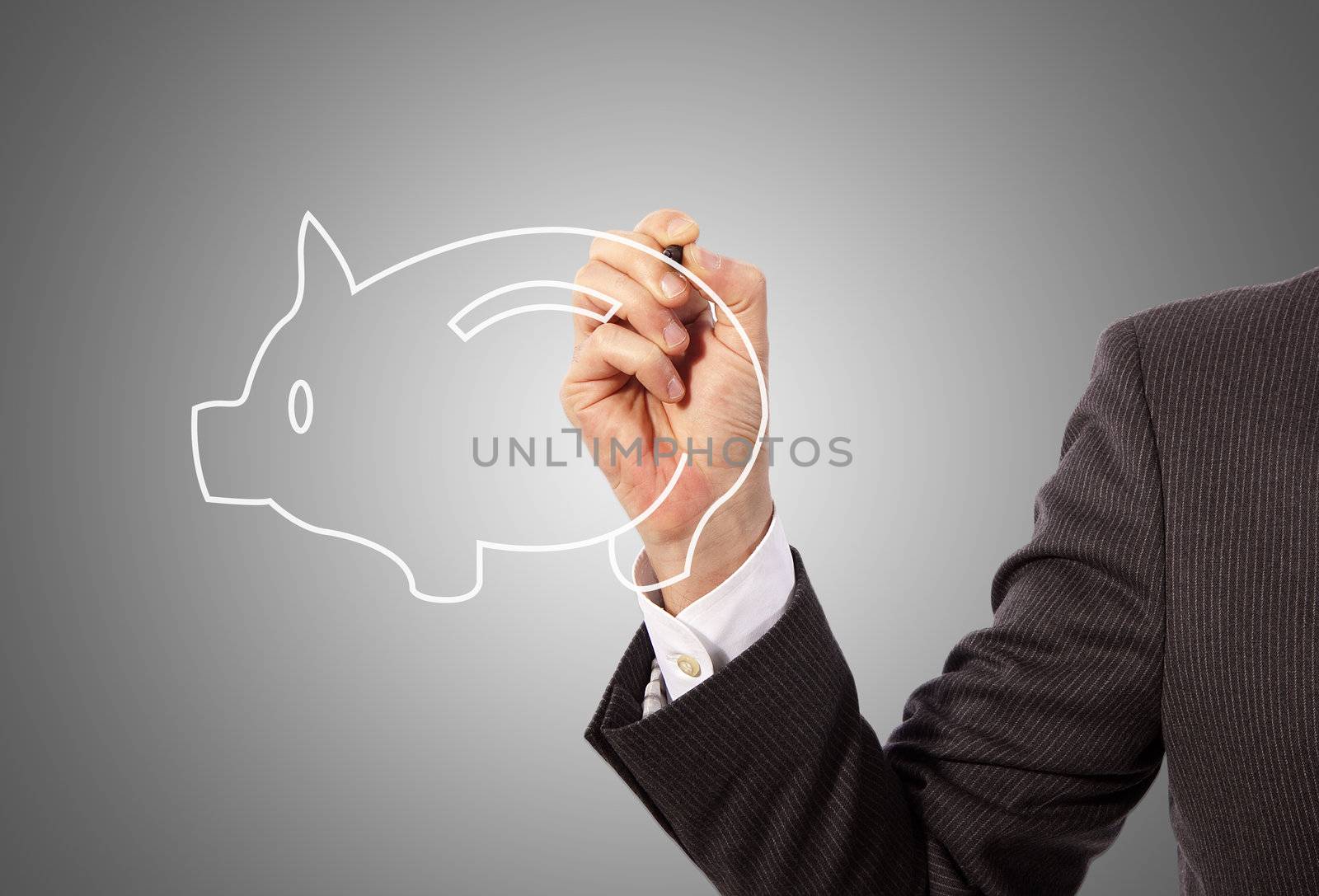 Male hand drawing a piggy bank, grey background