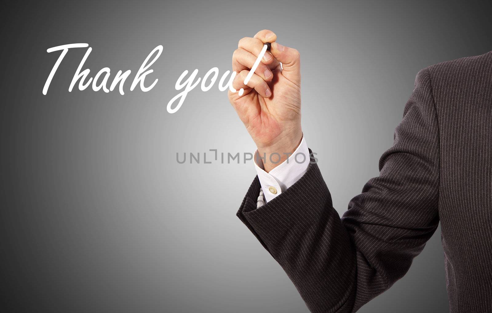 businessman write 'thank you' on glass