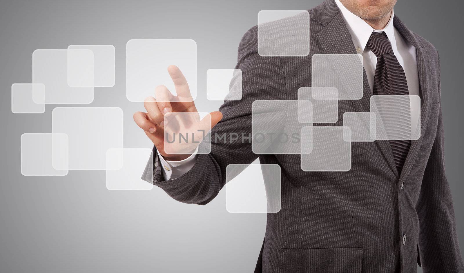 business man touching virtual screen, grey background