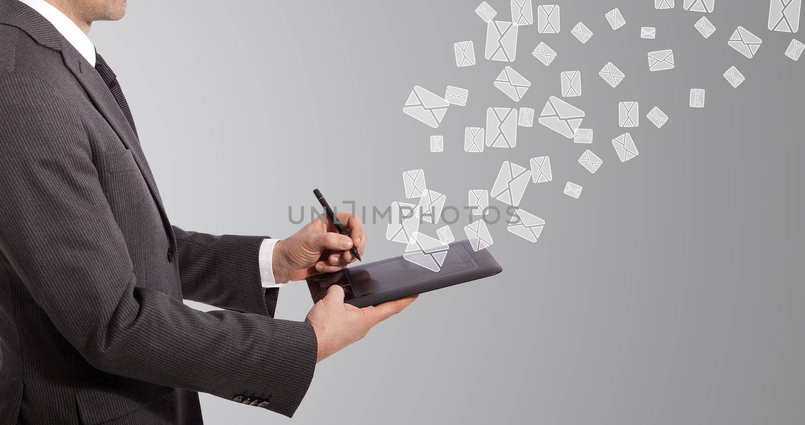 business man write mail on tablet, grey background