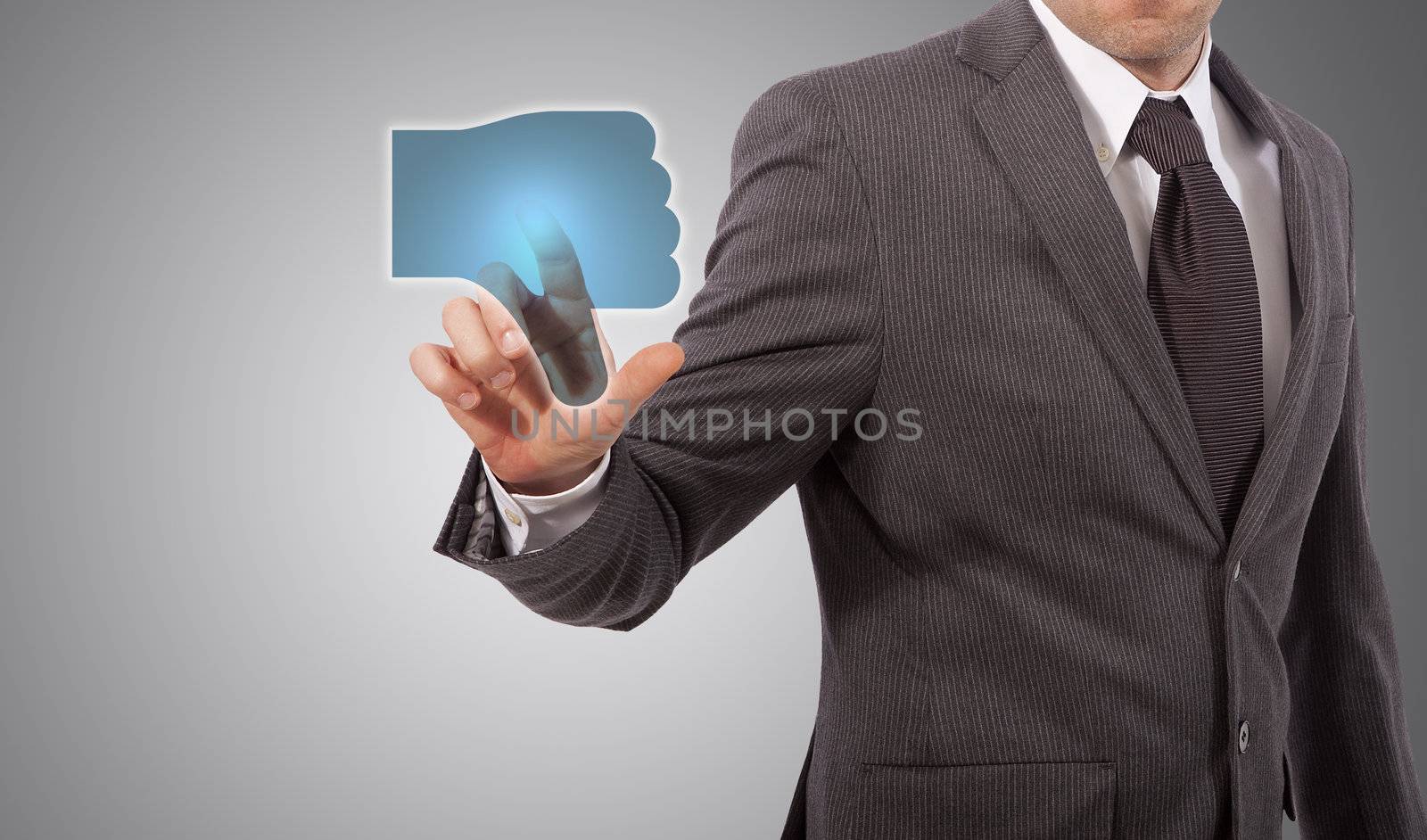 Businessman Presses a dislike Button, grey background