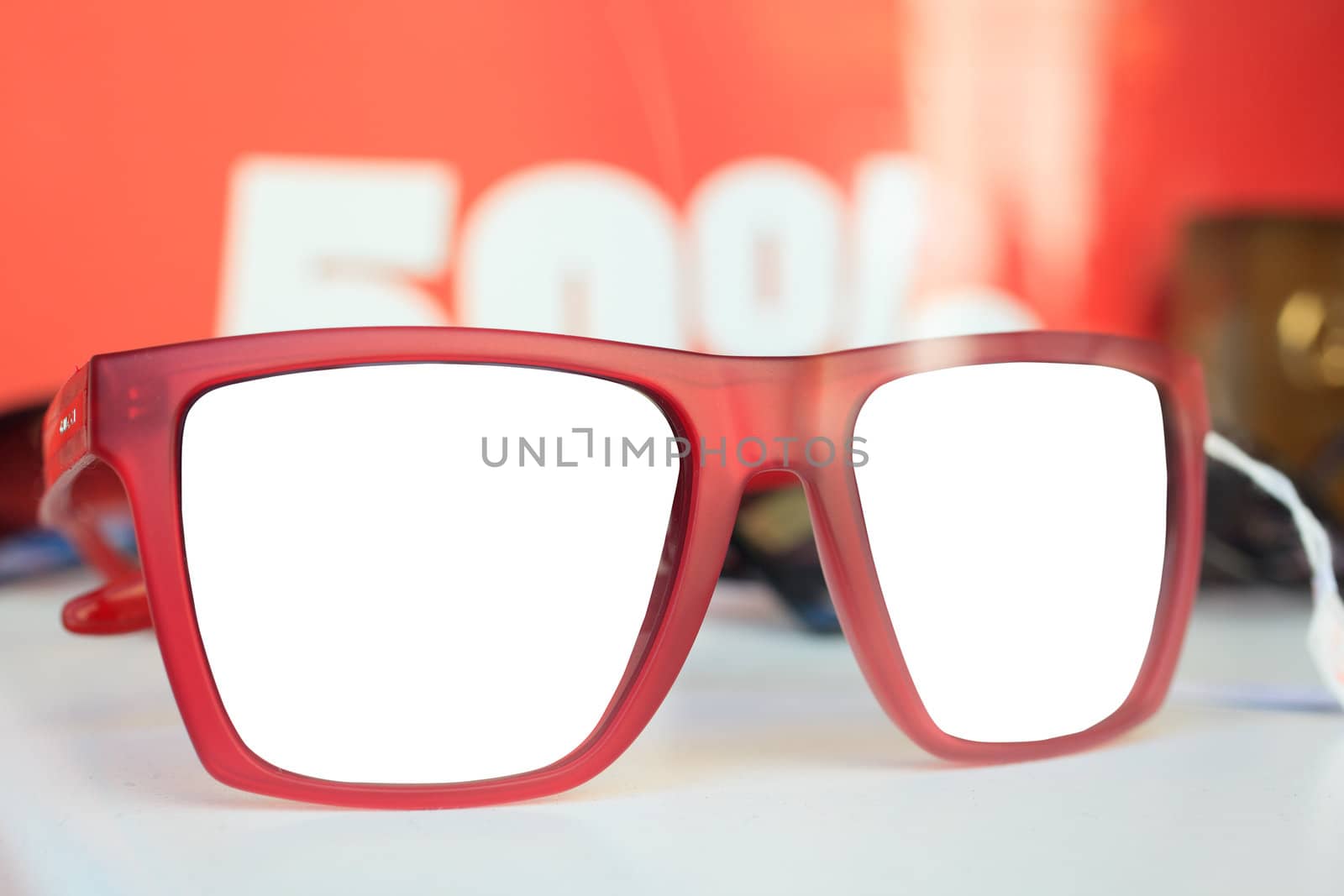 Photo of red glasses on white surface