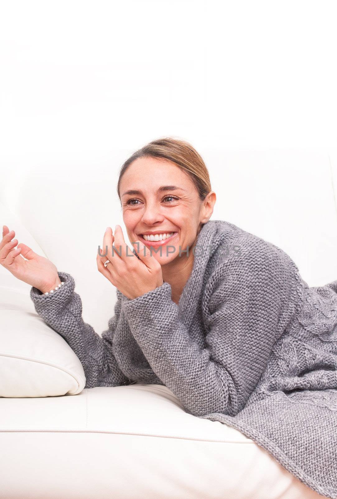 woman smiling on sofa