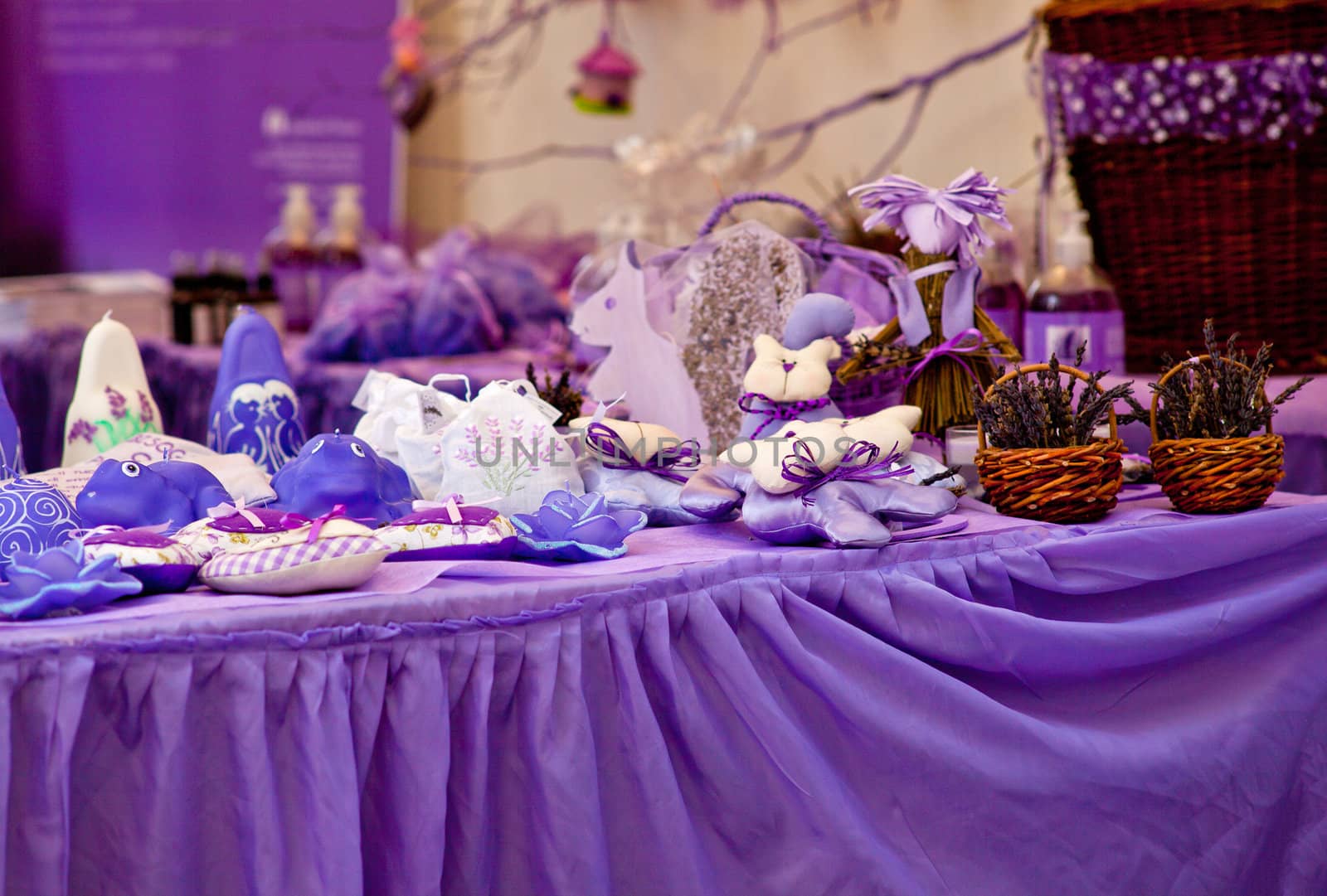 Candles and other object in a purple stand