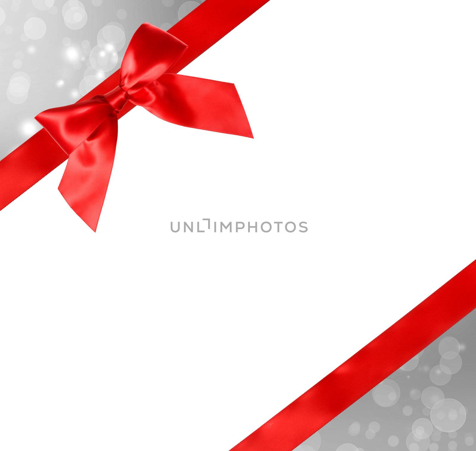 Red Bow and Ribbon with Silver Abstract Lights and White Background 