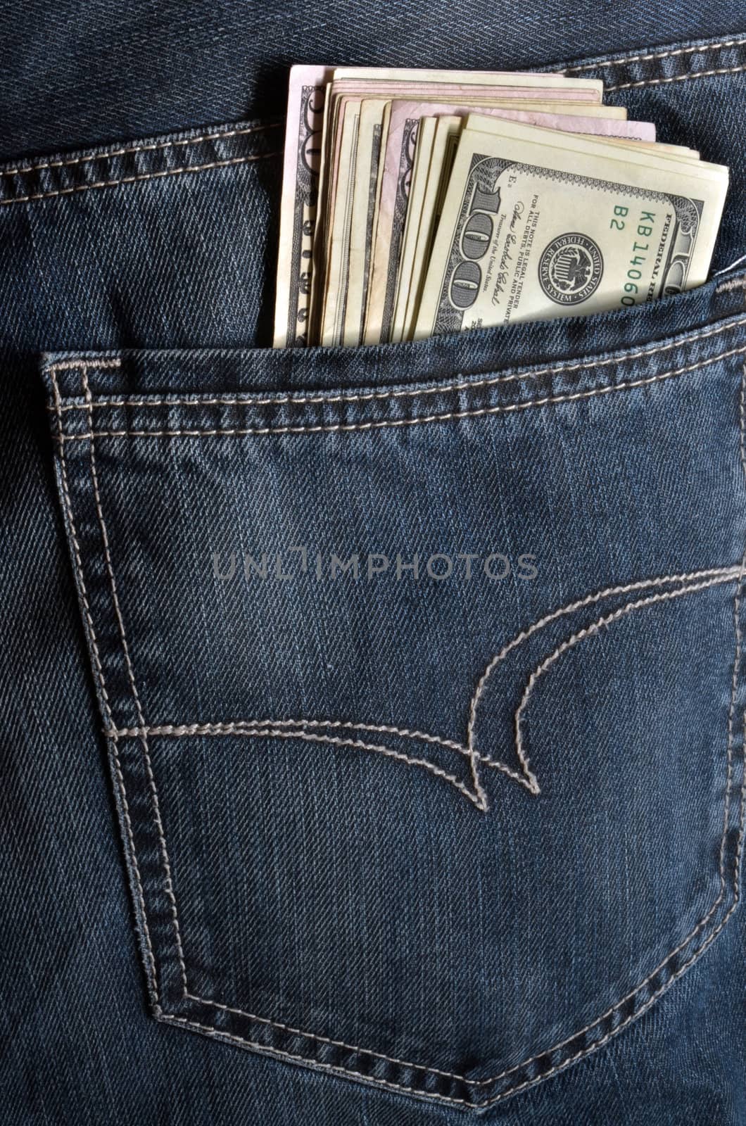 Jeans pocket with few hundreds american dollars.