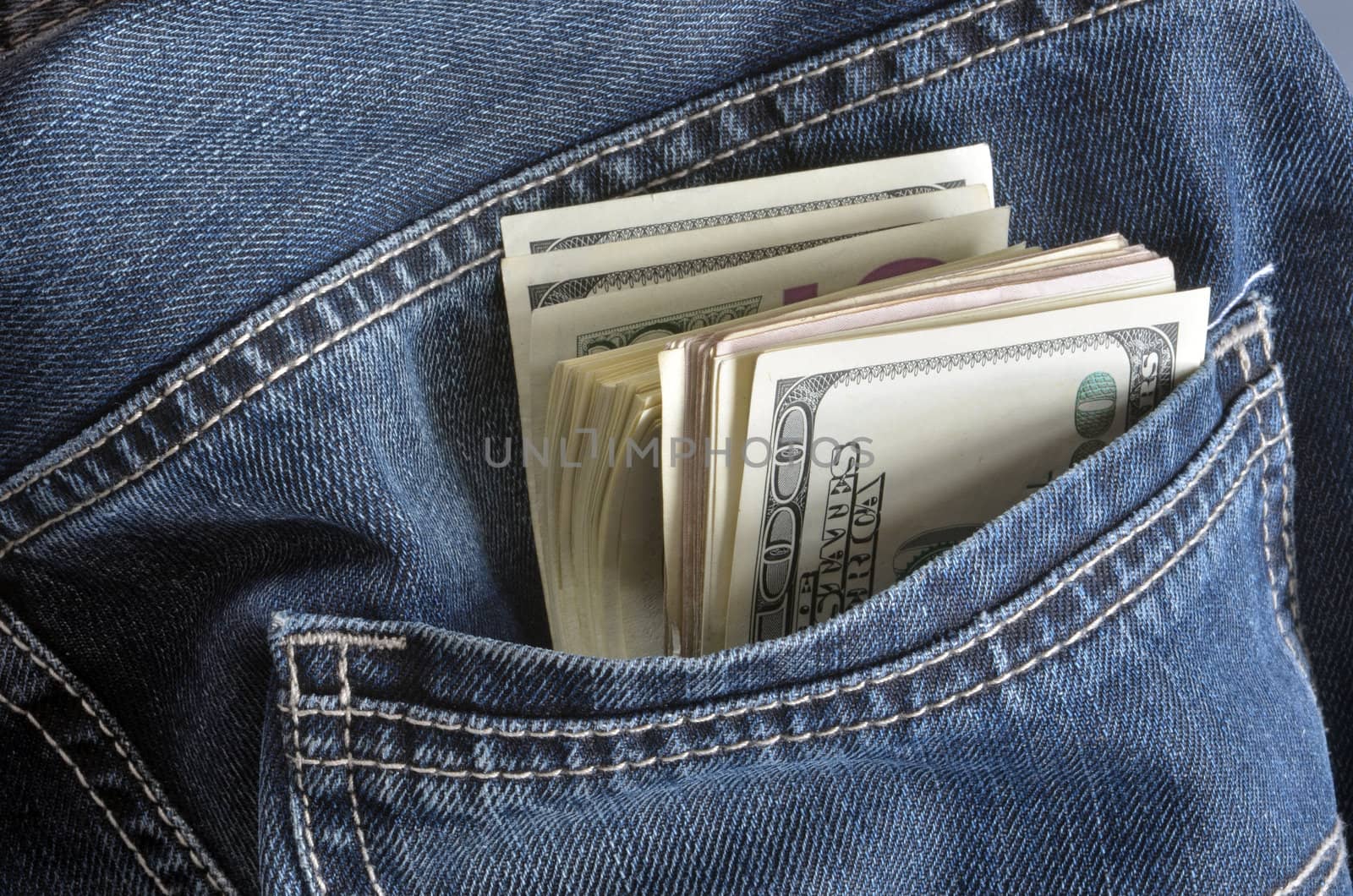 Jeans pocket with few hundreds american dollars.