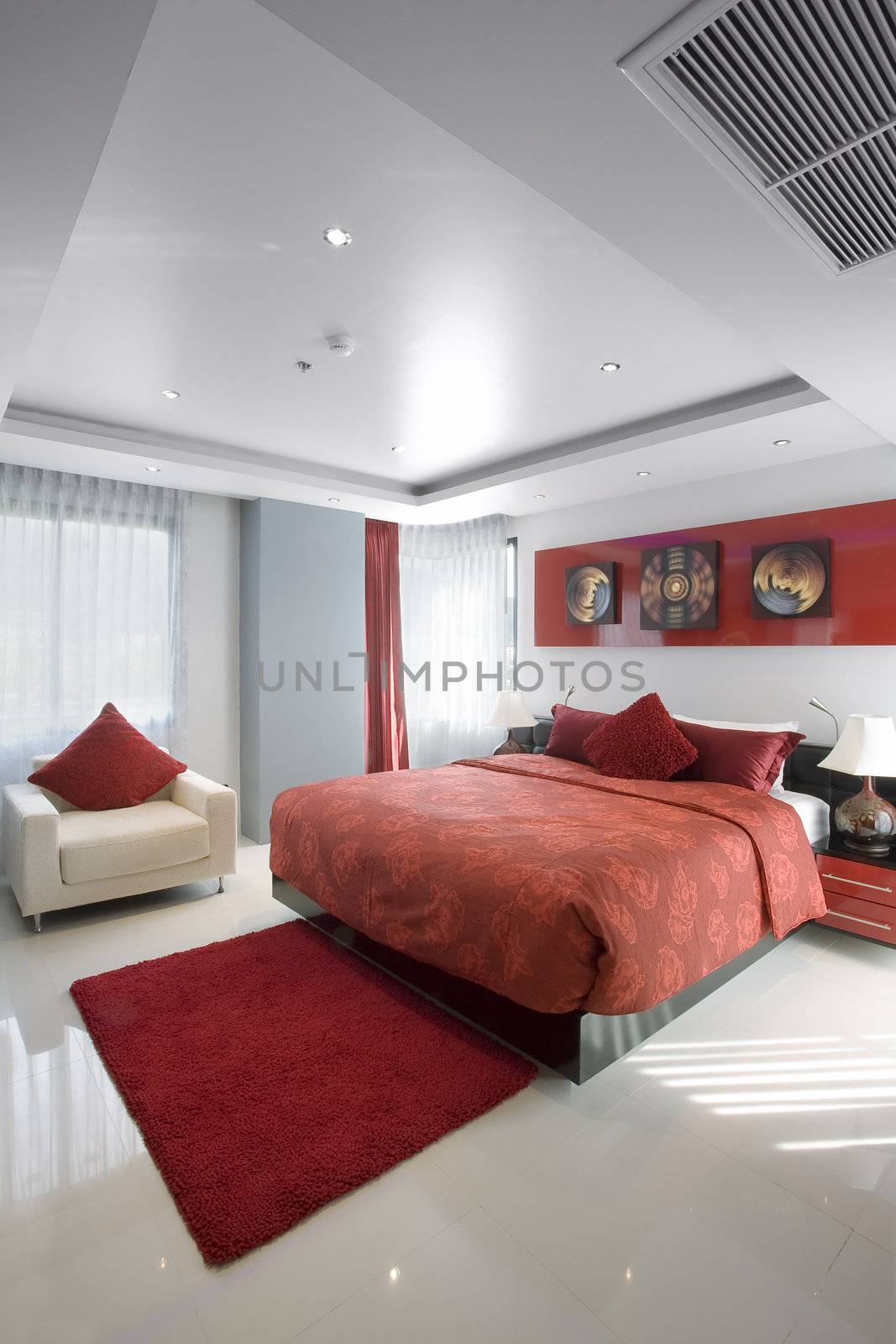 Panoramic view of nice stylish modern bedroom. Images on the wall were changed.