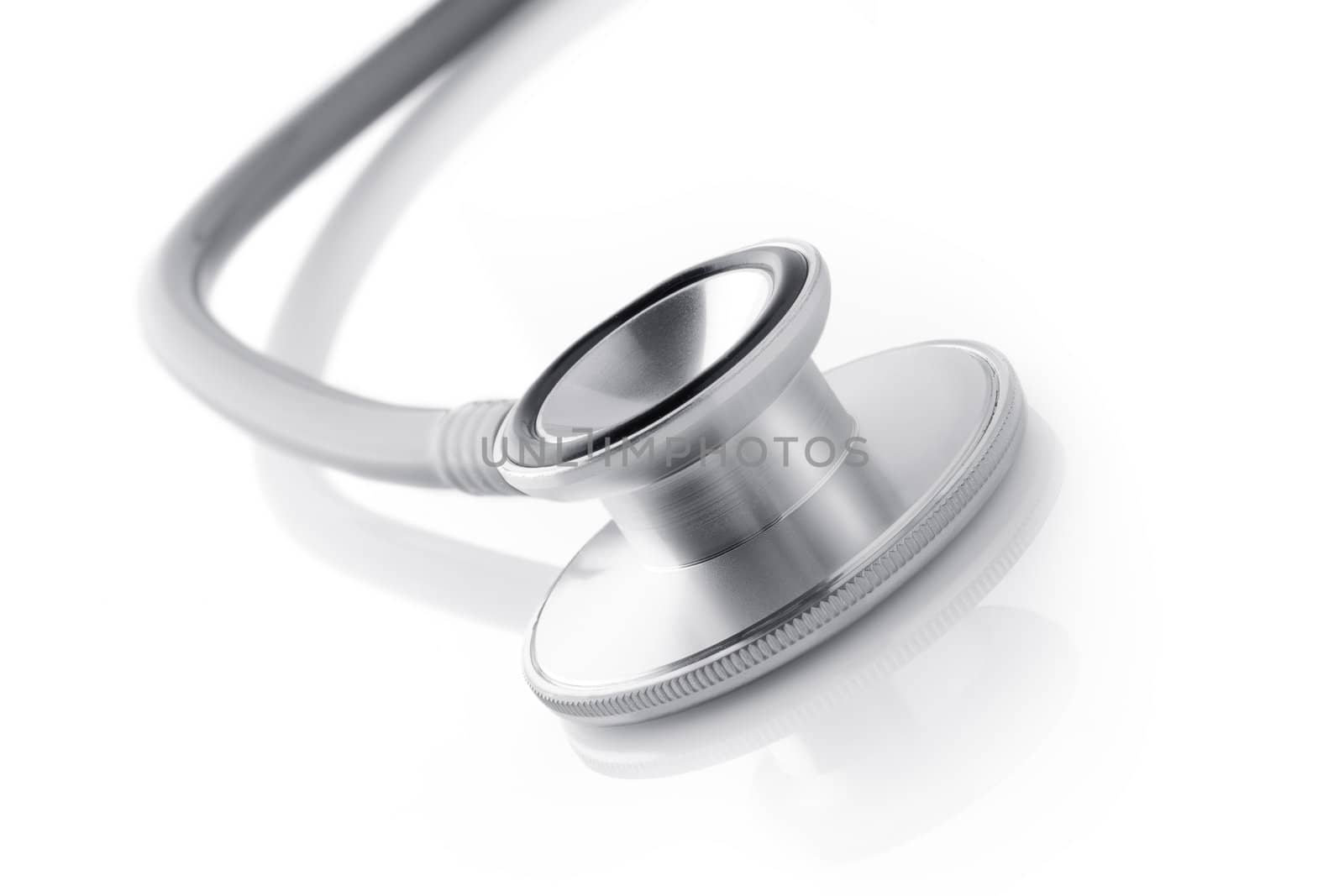 Close up view of grey stethoscope on white back by ersler