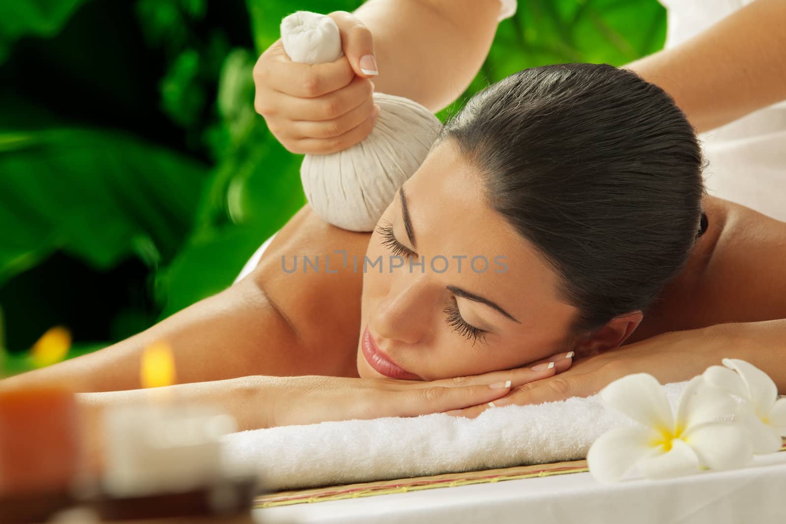 portrait of young beautiful woman in spa environment by ersler