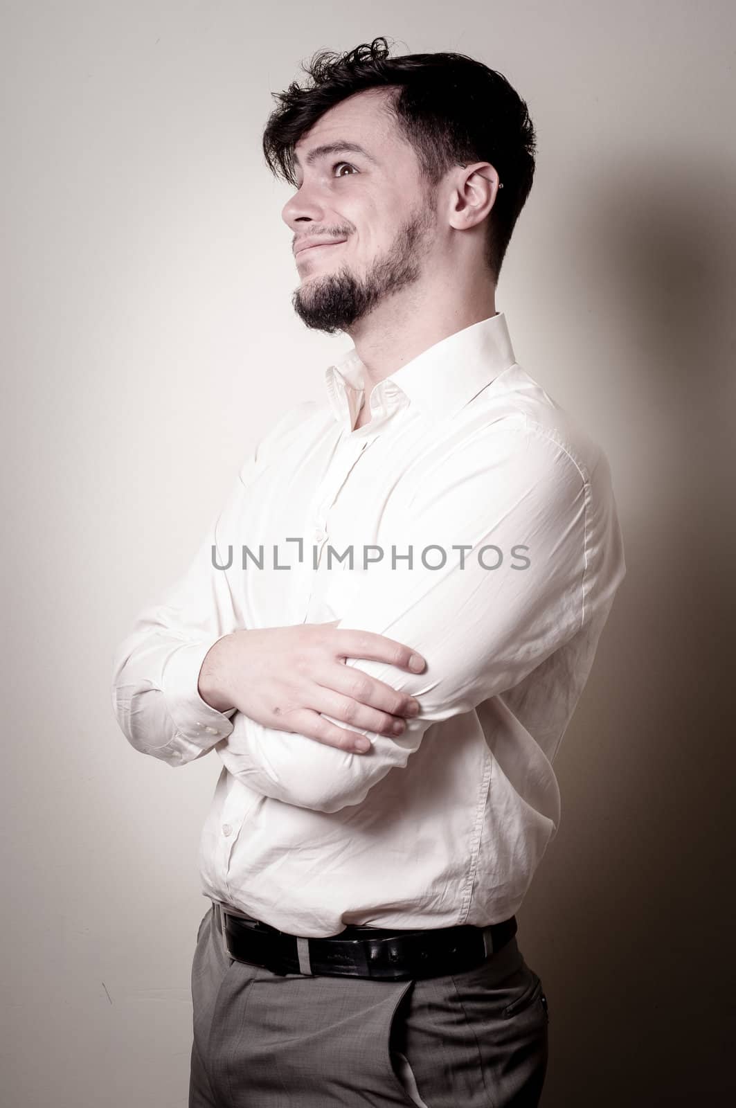 stylish modern guy with white shirt on gray background