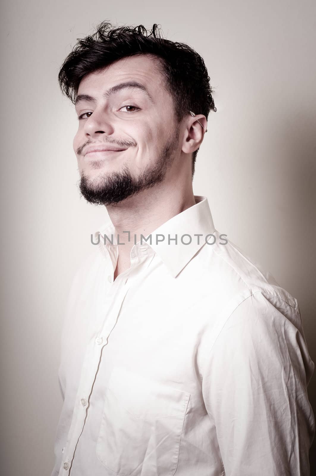 stylish modern guy with white shirt on gray background