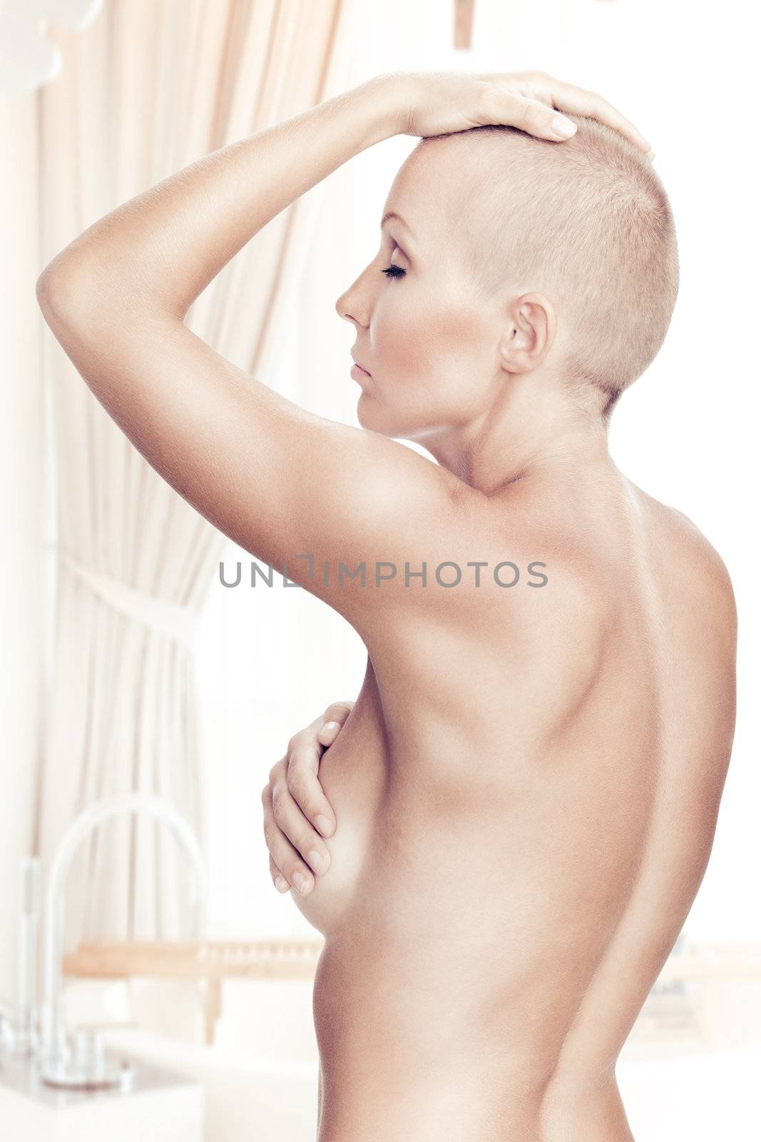 Portrait of nice young naked woamn on color back by ersler
