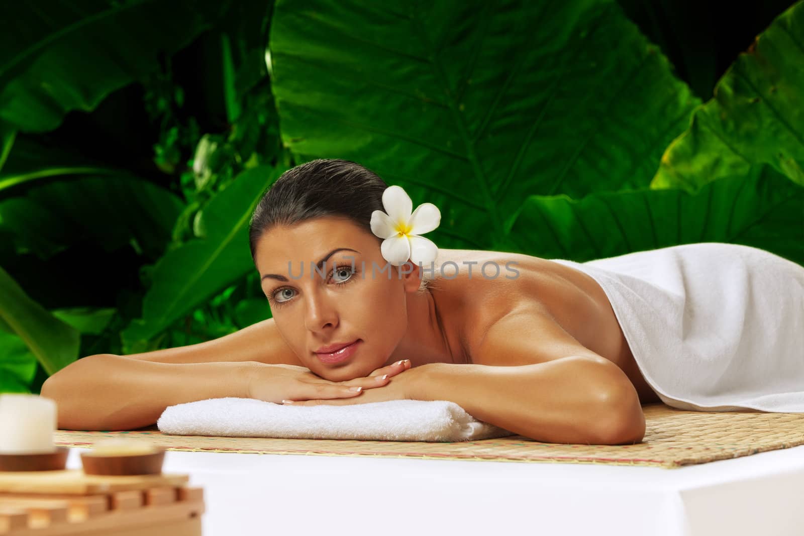 portrait of young beautiful woman in spa environment. by ersler