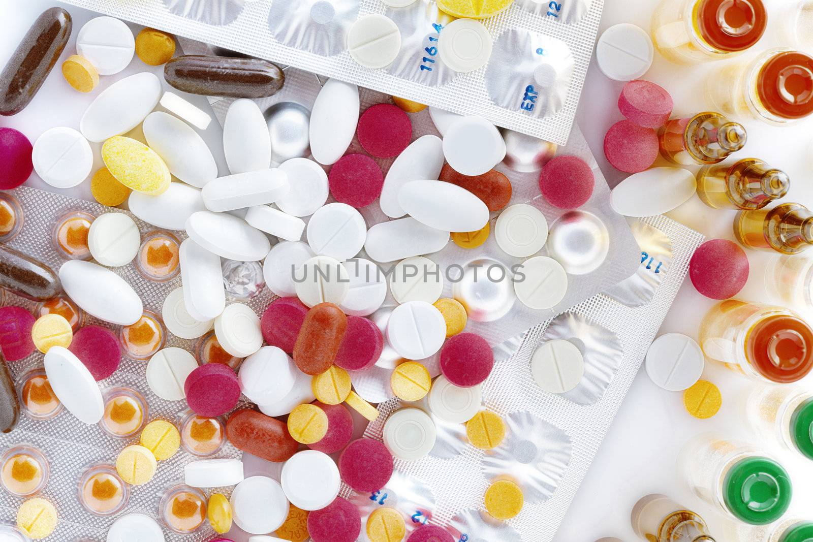 Close up view of different pills on white back