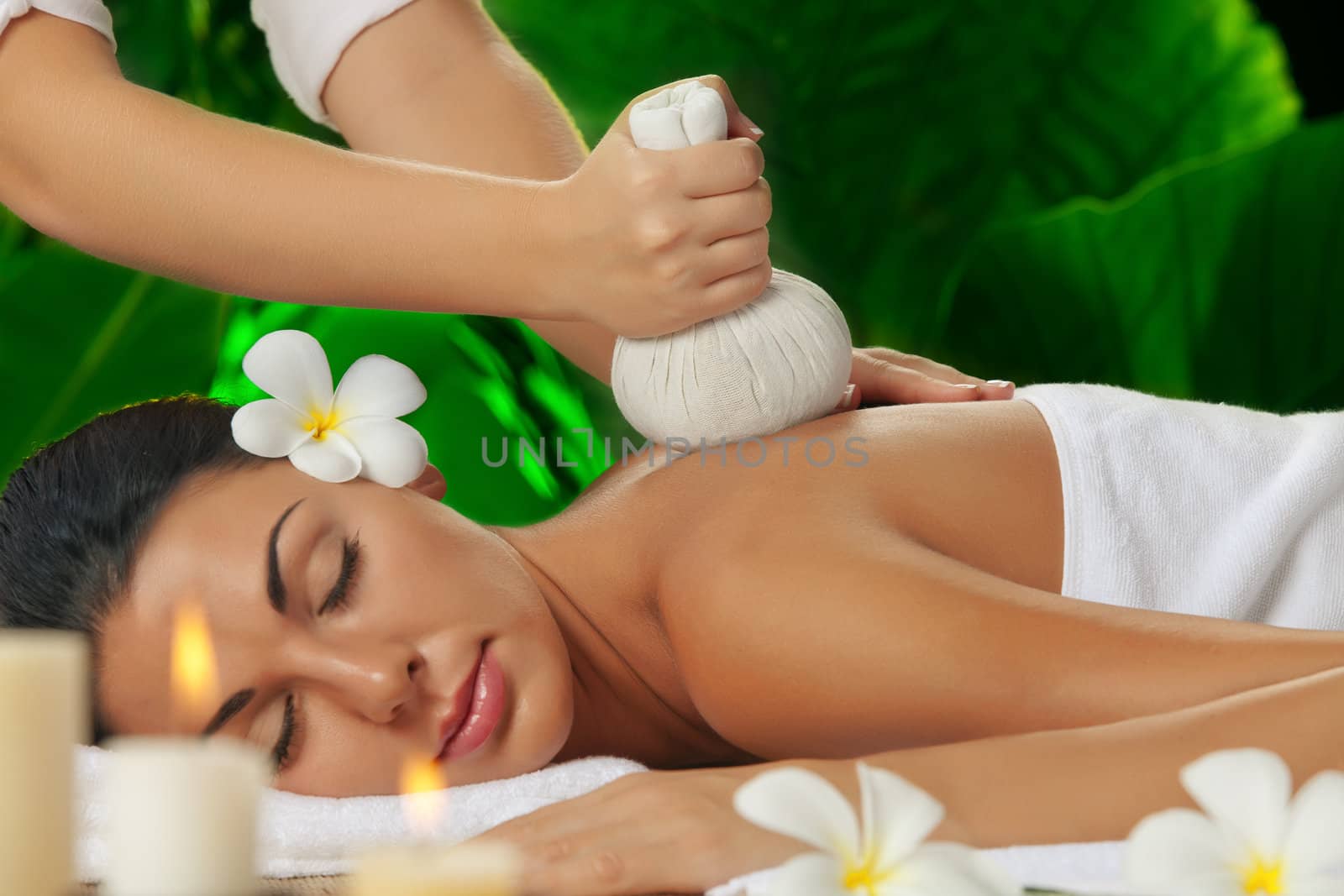 portrait of young beautiful woman in spa environment.