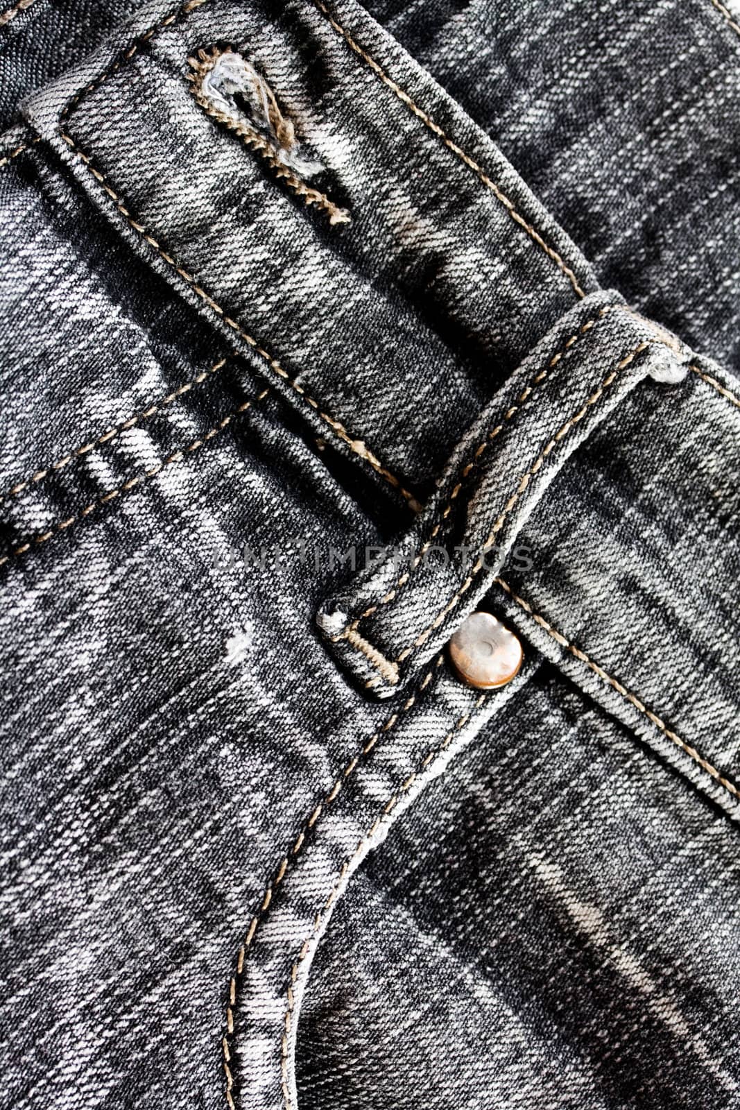 Beautiful denim jeans background with seams and rivets