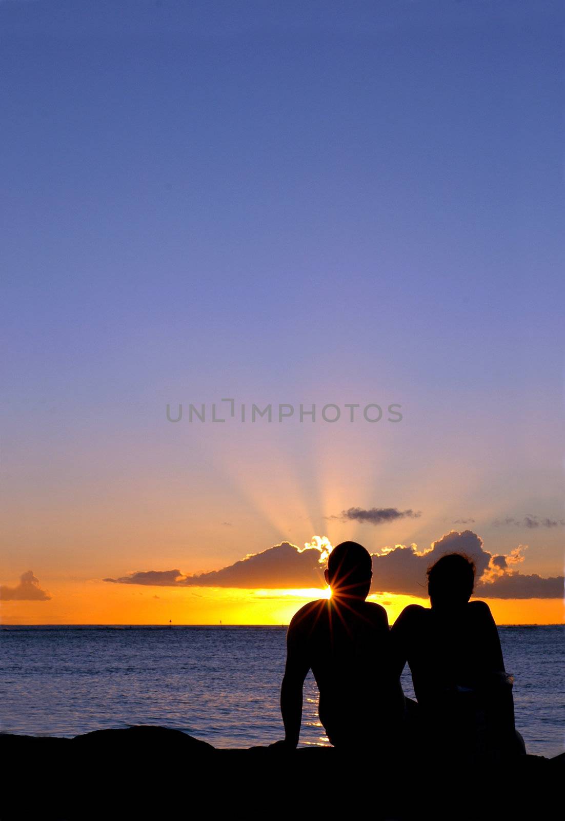 Romantic Vacation Image of a Loving Couple at Sunset With Copy Space