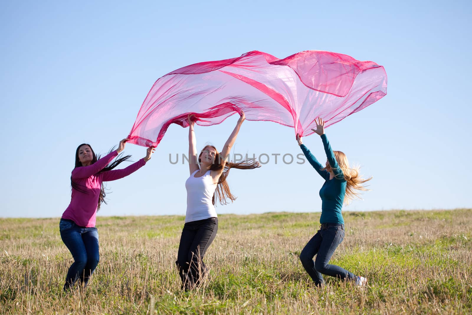 beautiful teenager woman jumping with a thin tissue outdoor by jannyjus
