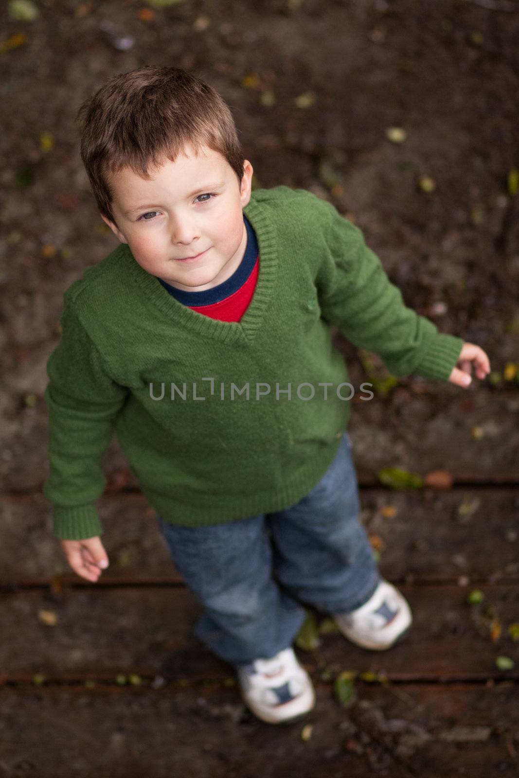 Young boy looking up by Talanis
