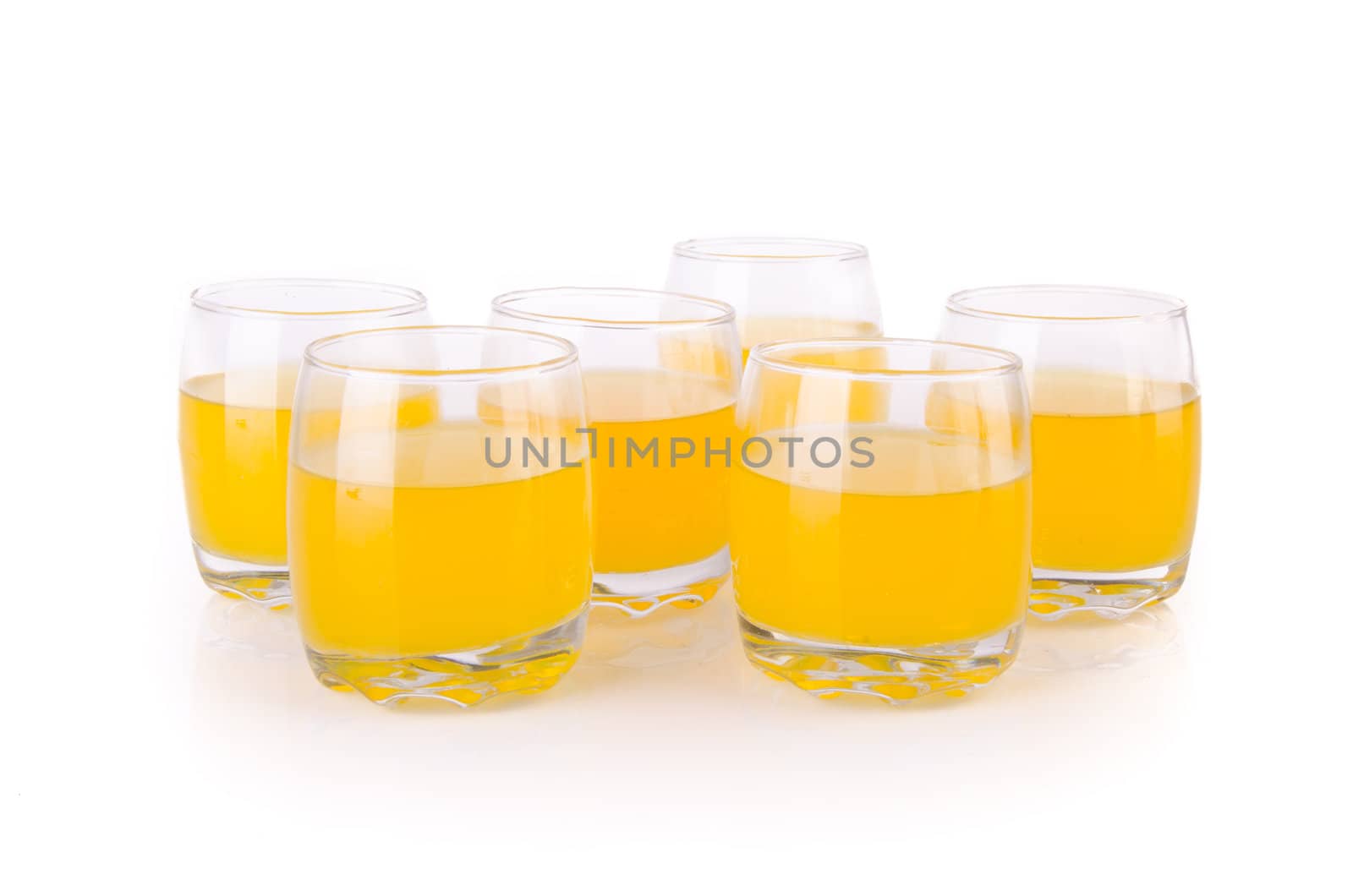 Orange juice in glasses on the background