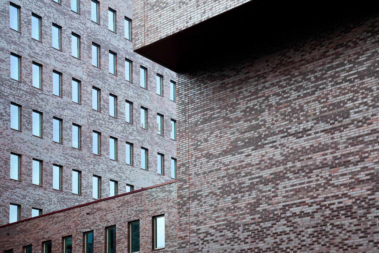 brick walls of office building by ahavelaar