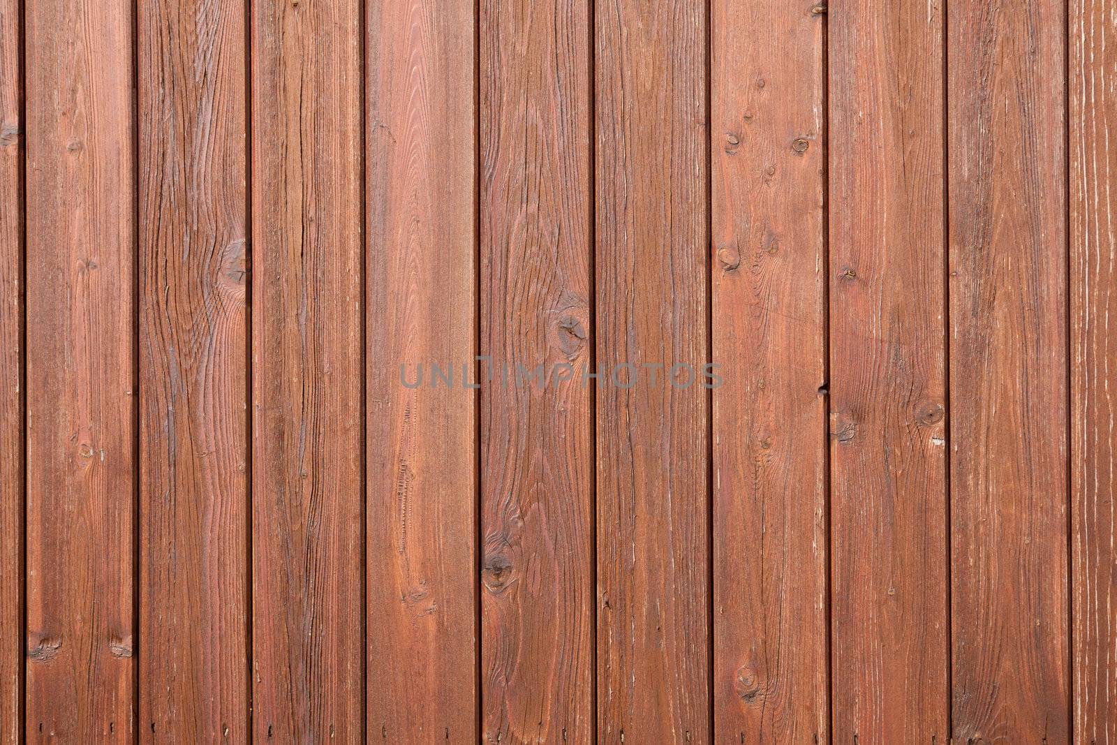 part of fencing or boardingwith brown varnish