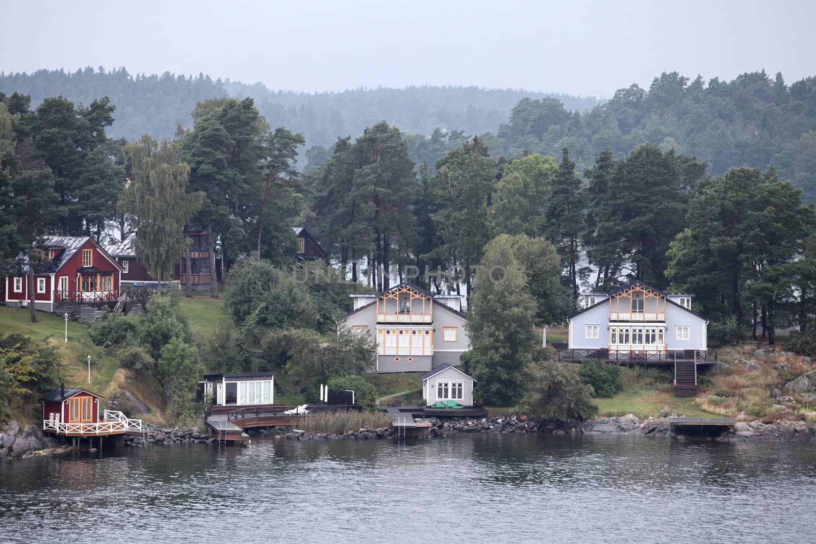 home located on the shore of the lake in the morning