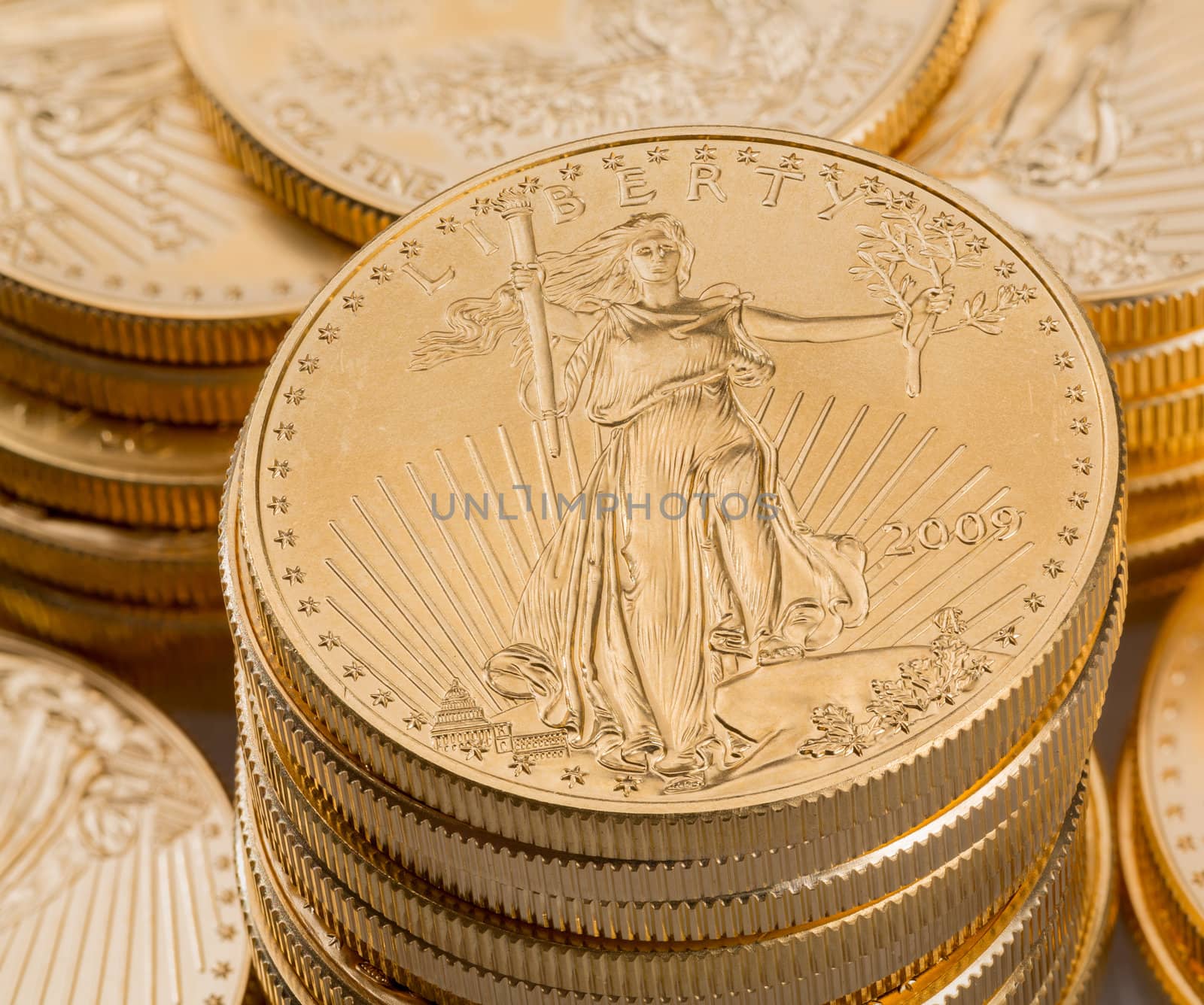 Stacks of gold eagle one troy ounce golden coins from US Treasury mint