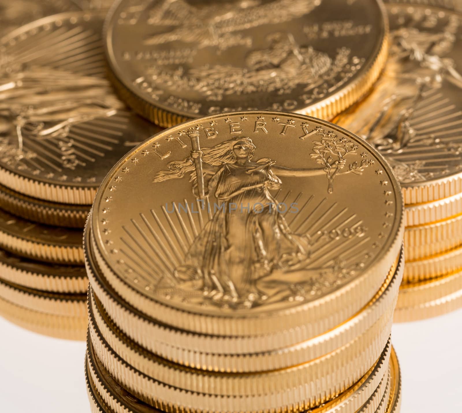 Stacks of gold eagle one troy ounce golden coins from US Treasury mint