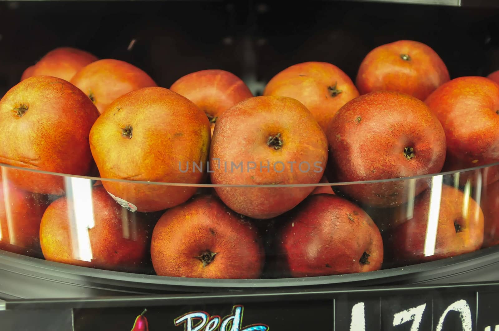 apples on shelf at the supermarket on display
