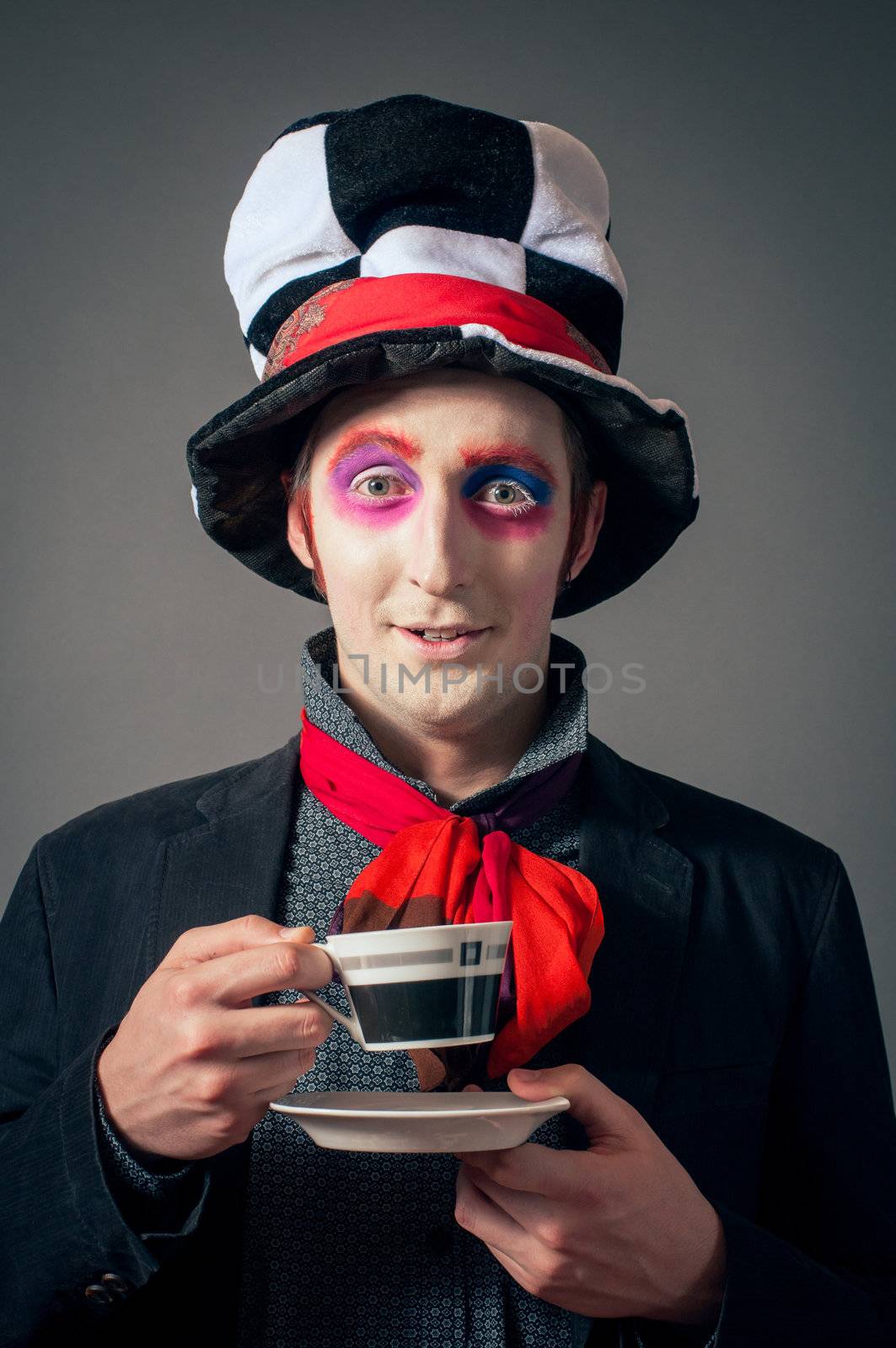Young man in the image of the Crazy Hatter from "Alice's Adventures in Wonderland" by Lewis Carroll