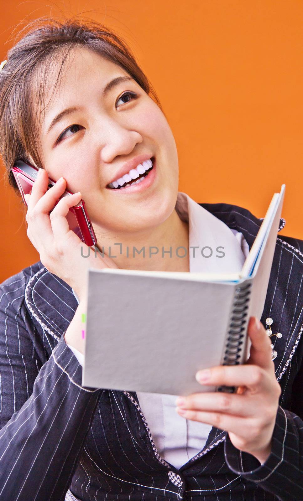 Business woman talking on the phone by Myimagine