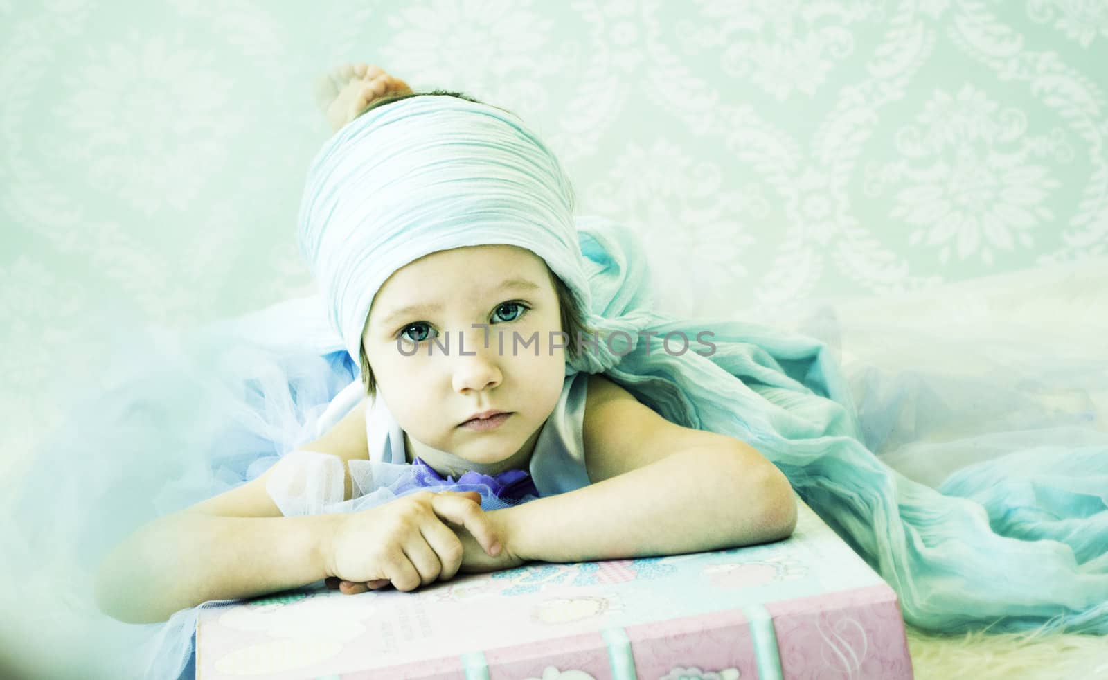 girl is lying down on the big book, magical photo







little girl is