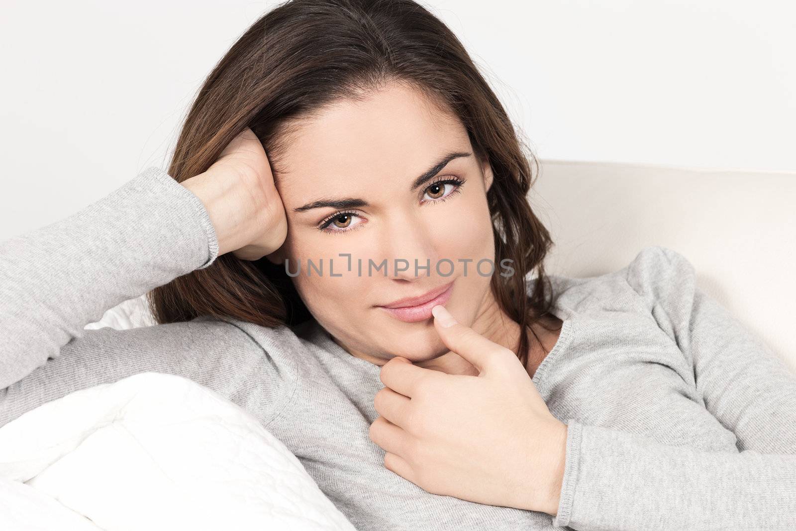 Young beautiful woman on the sofa 