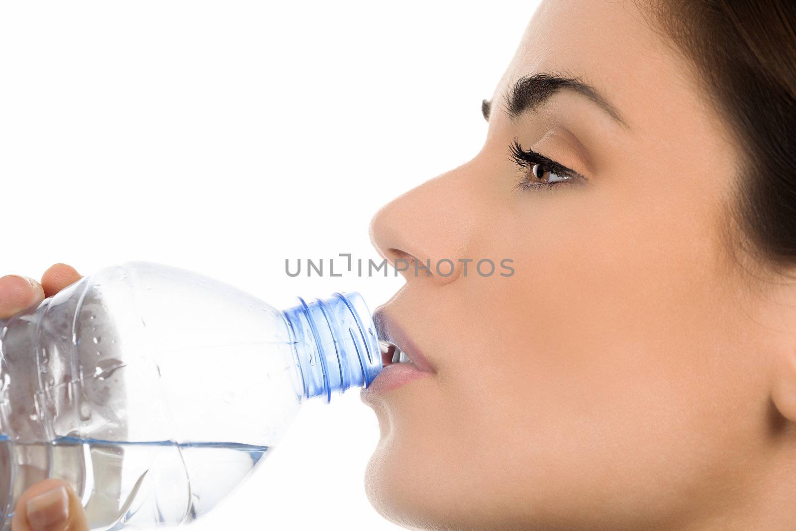 Young woman drinking mineral water bottle, 