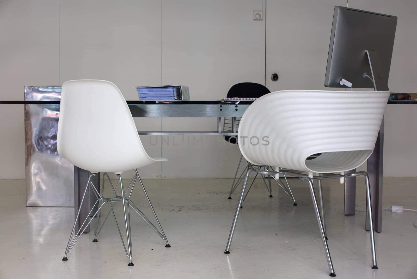 View of desk and chairs in a white office