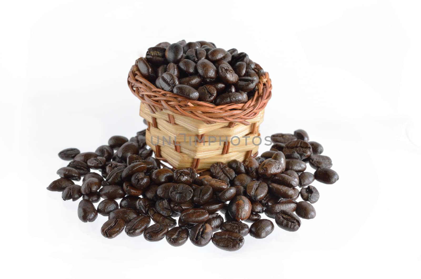 Coffee beans and basket isolated on white