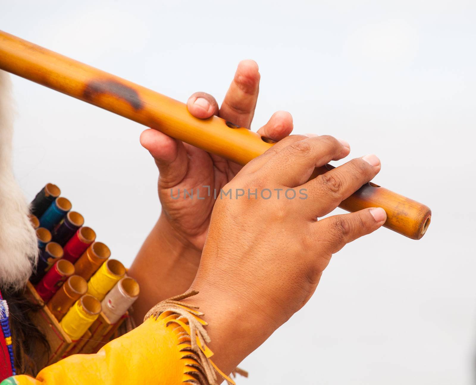 Peruvian Man In Native Costume Playing flute