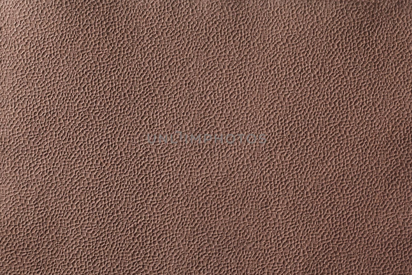 Background texture of brown bumpy handmade paper.