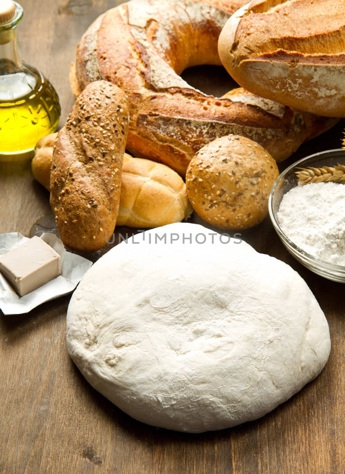ingredients for homemade bread on wooden background