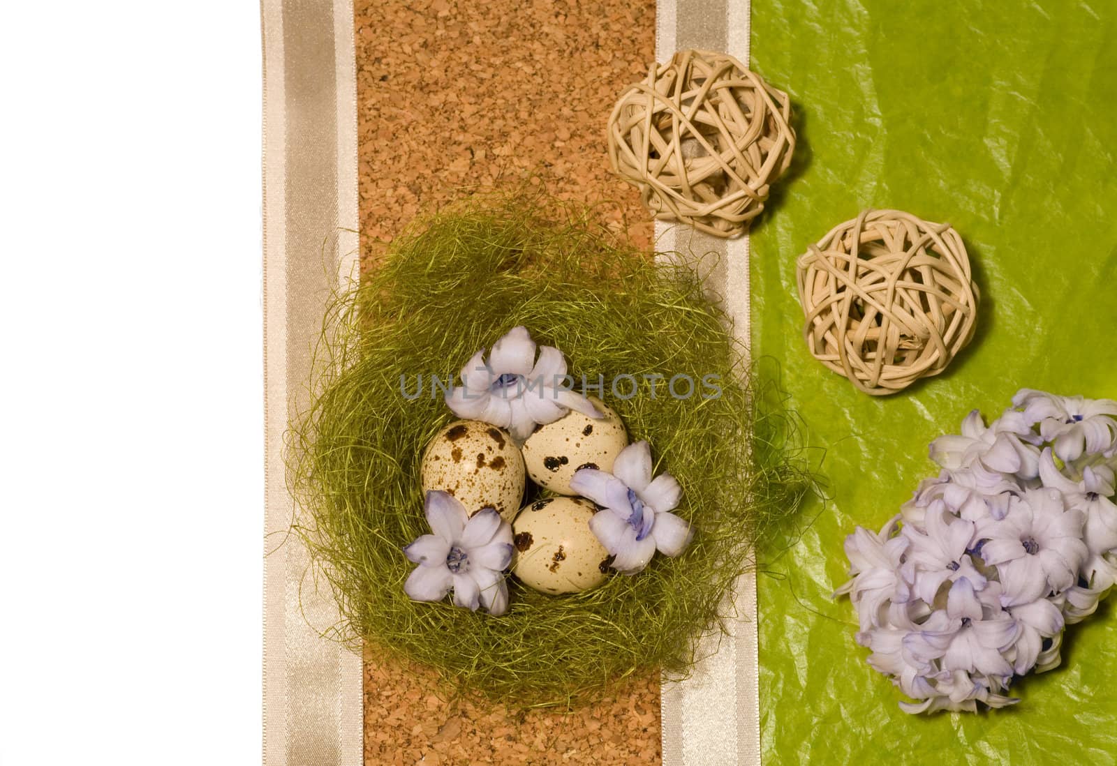 Easter eggs  in nest, blue hyacinth and wooden ball
