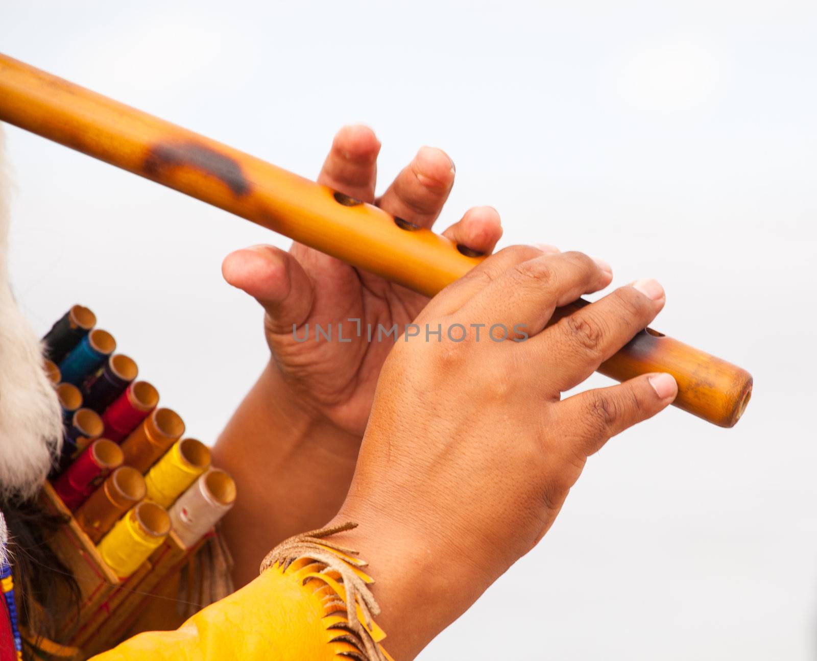 Peruvian Man In Native Costume Playing flute