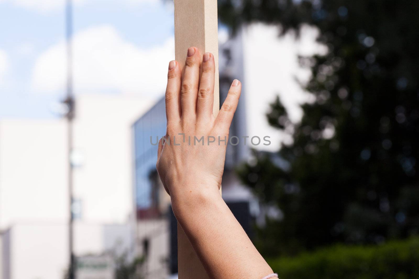 Girl with Wooden pole held by hand
