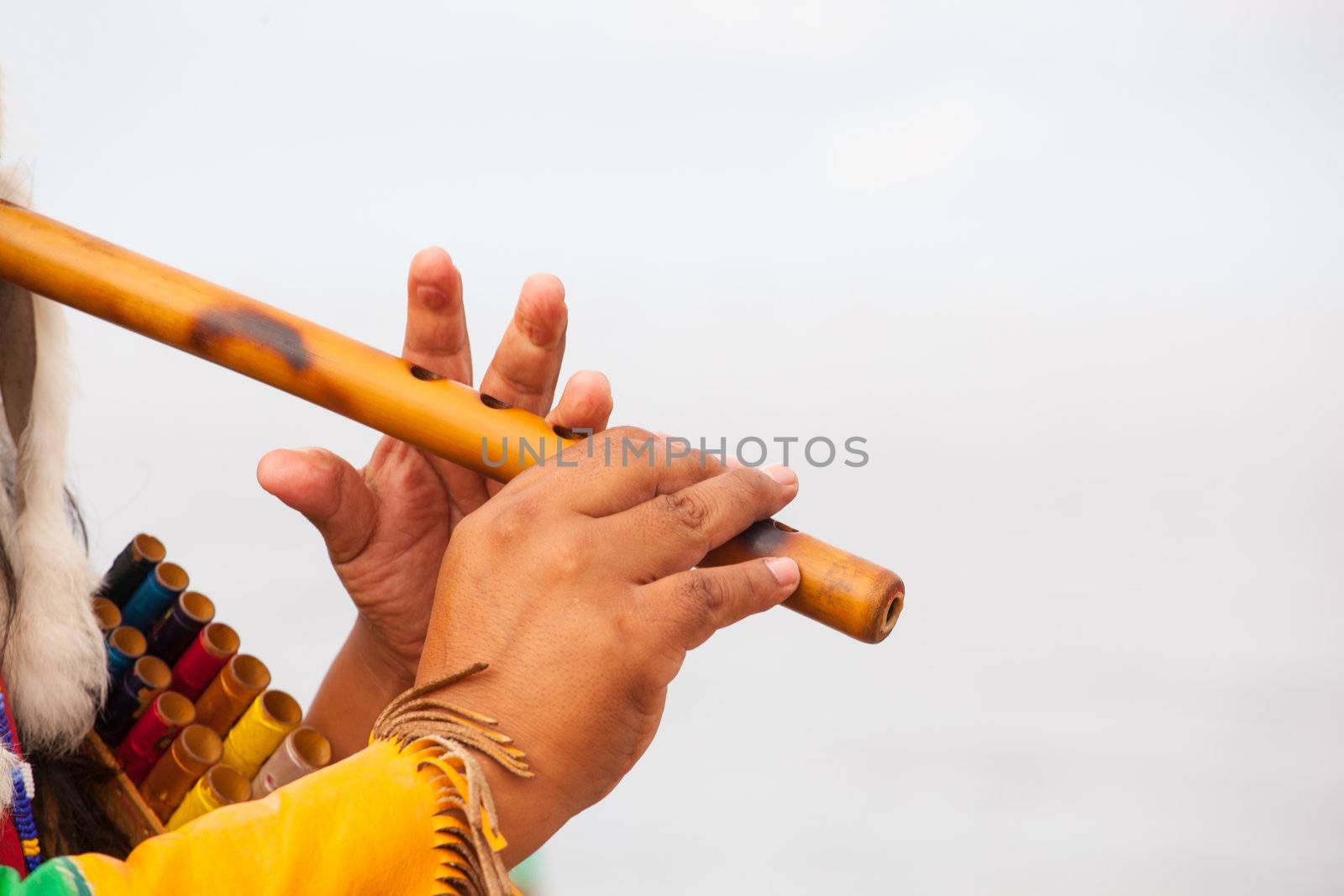 Peruvian Man In Native Costume Playing flute