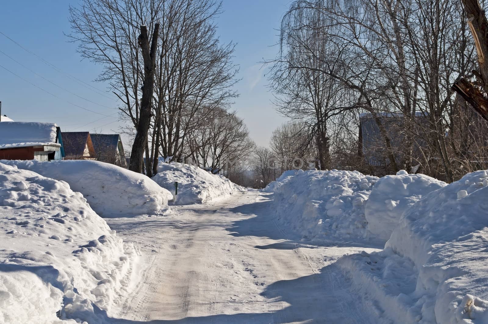 Drifts on the street in a Russian village