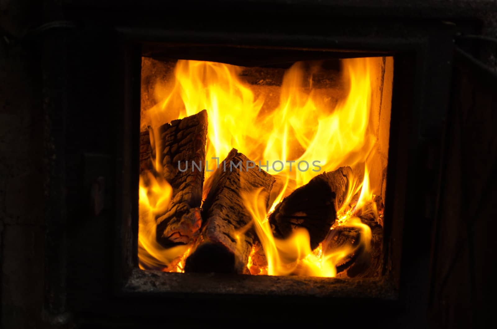 firewood wood burn retro old rusty rural kitchen brick stove.