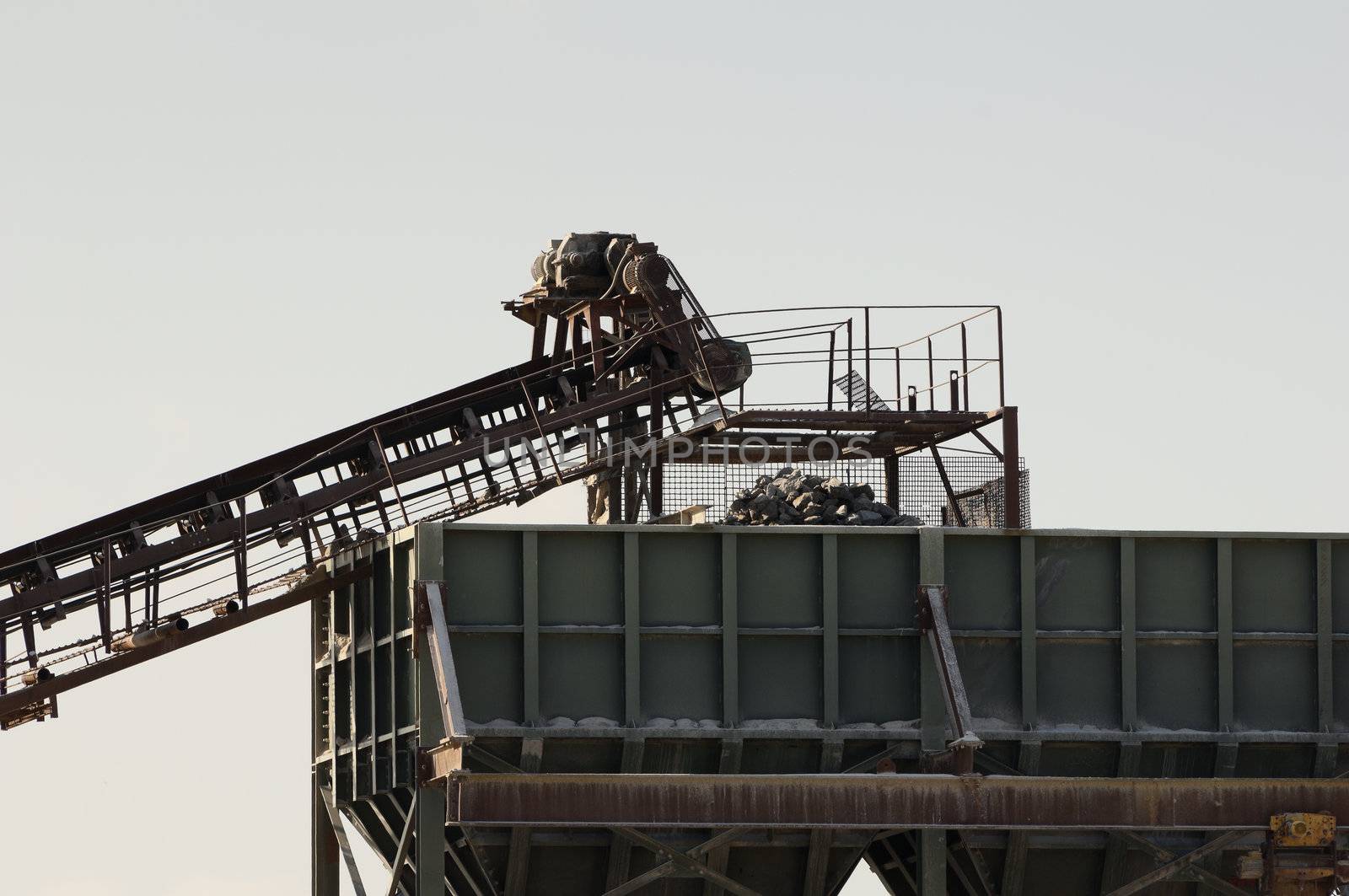 Detail of a conveyor belt filling a stone crusher